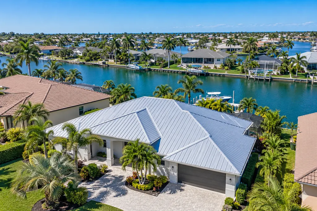 Metal roof replacement on a canal-front home in Cape Coral, Florida
